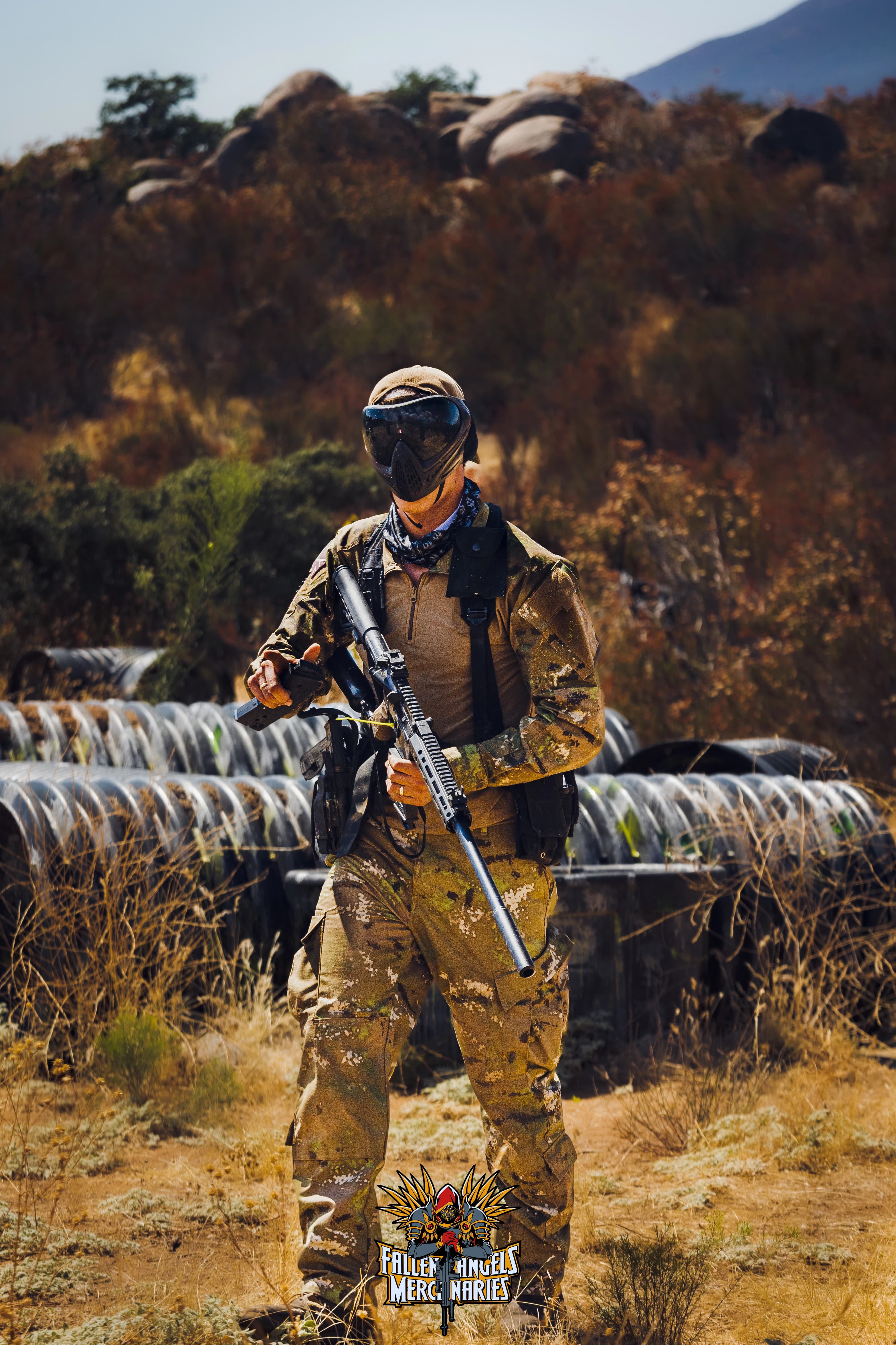 Fallen Angels Mercenaries player standing ready with a magazine-fed marker