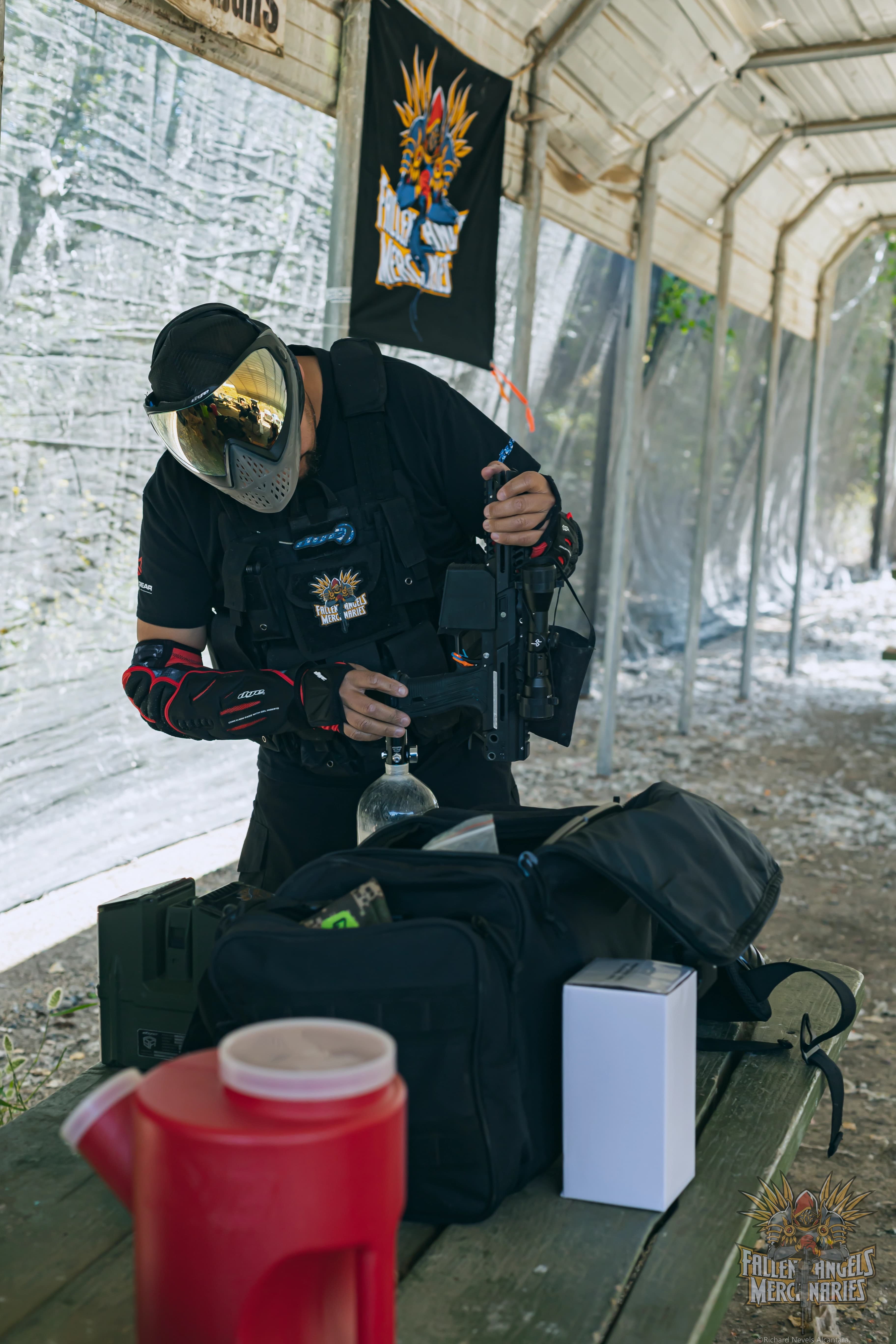 Player preparing a magfed paintball marker before gameplay