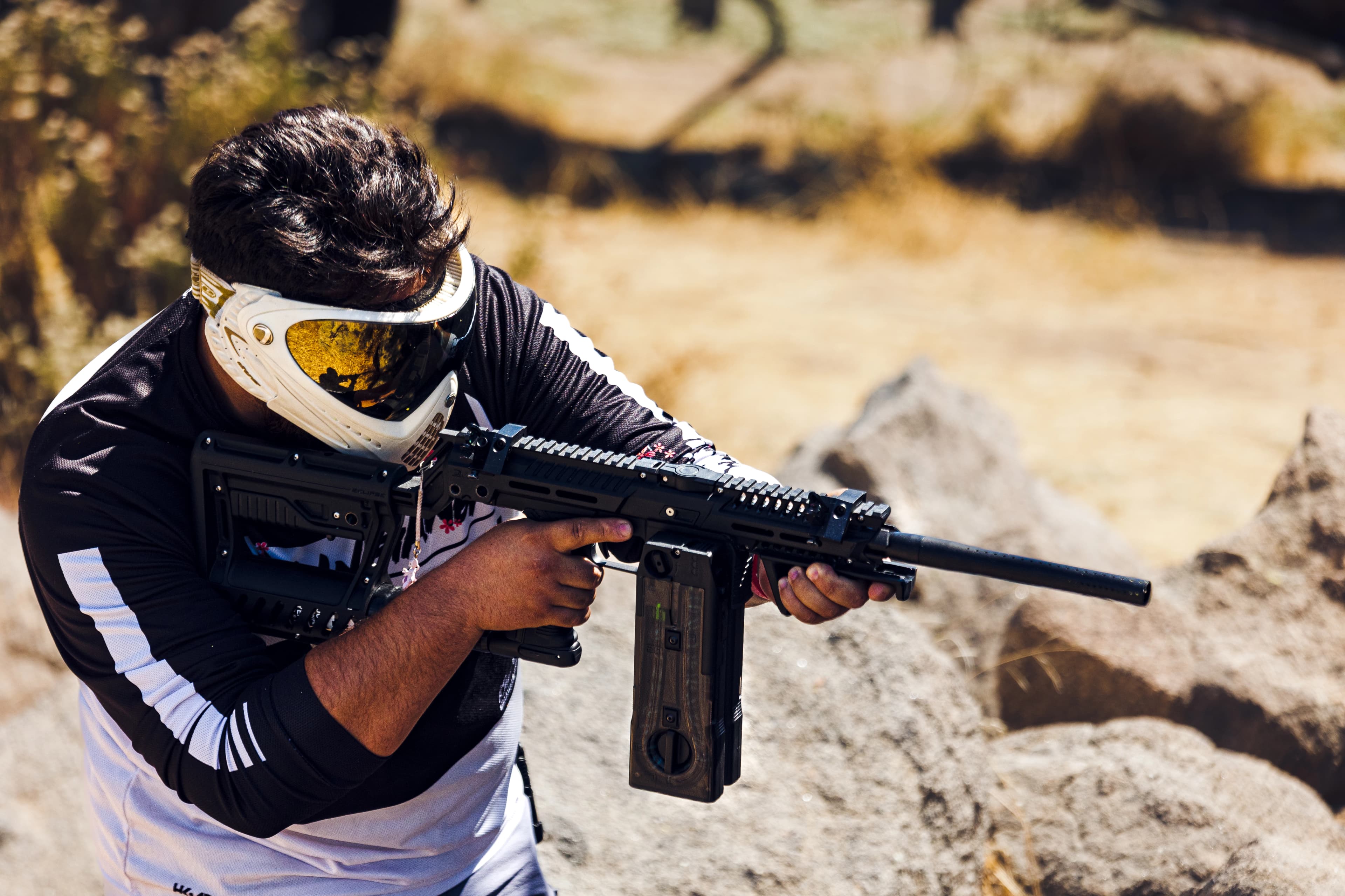 Player holding a magfed marker with dual magazine setup