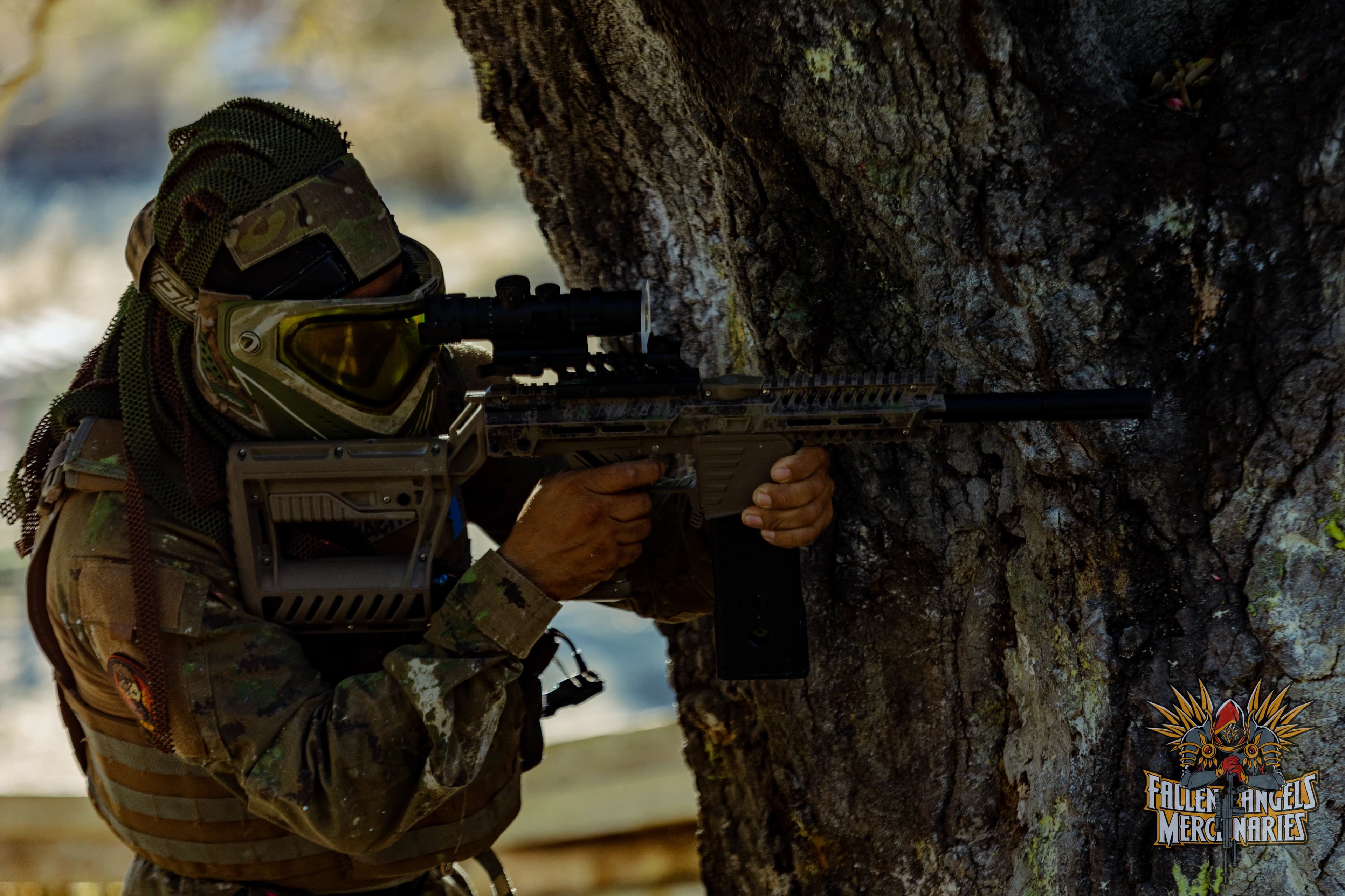 Player aiming with a magfed marker from tree cover